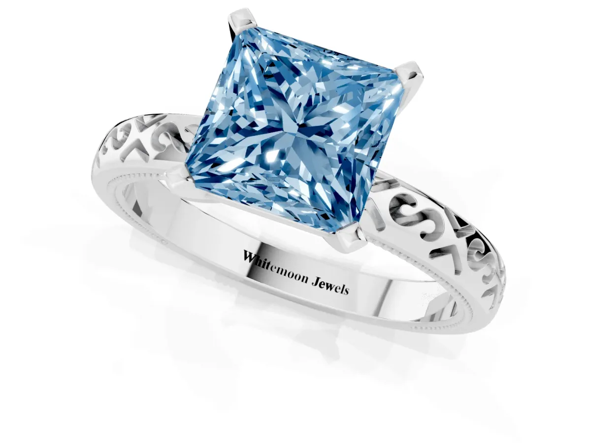 Fancy Blue Princess Cut Solitaire Engagement Ring with Scrollwork Band and Four-Prong Setting Silver