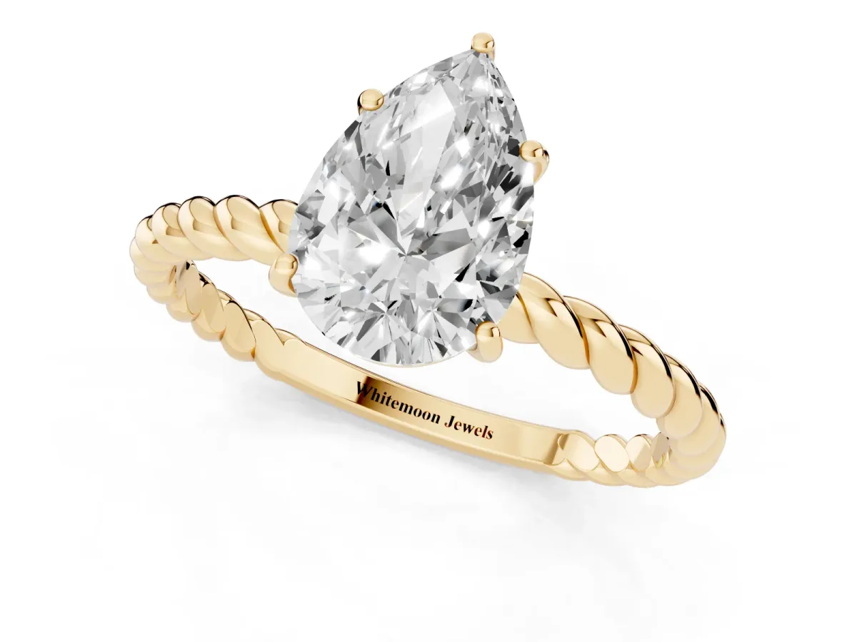 Pear Cut Solitaire Twist Band Ring with Four-Prong Setting Yellow gold