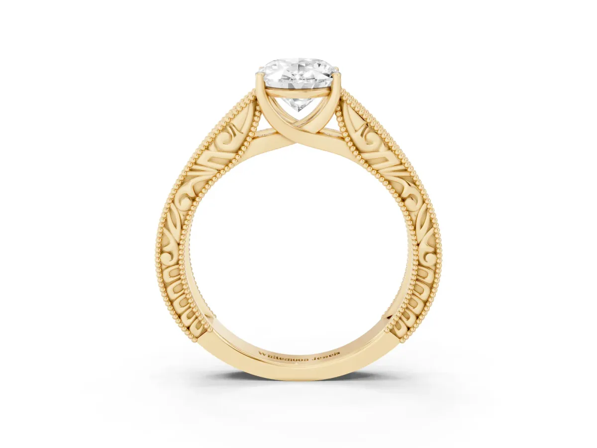 Oval Cut Diamond Solitaire Ring with Engraved Band and Four-Prong Setting Yellow gold