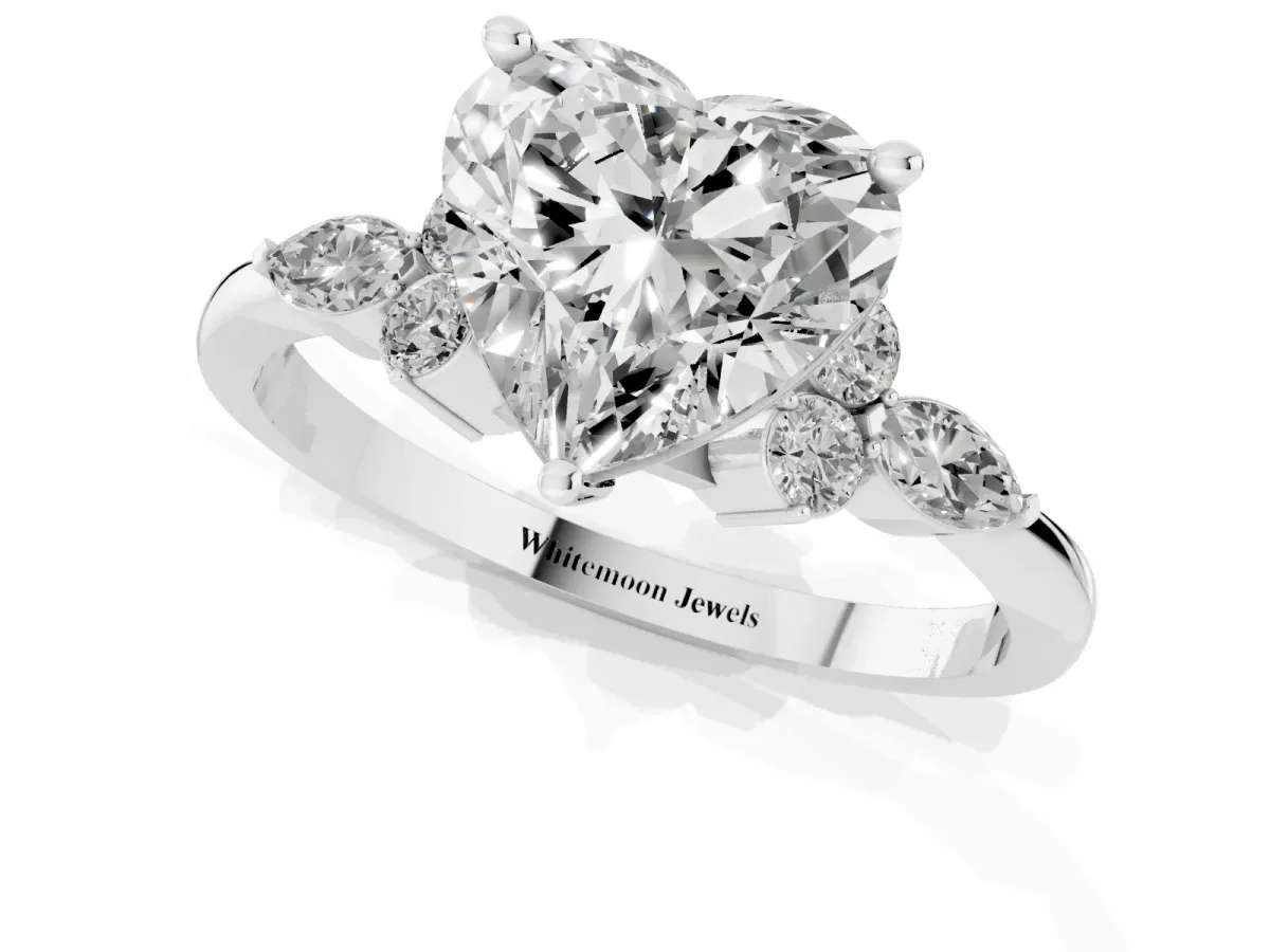 Heart Cut Brilliant Diamond Solitaire Ring with Pear Side Stones and Four-Prong Setting Platinum
