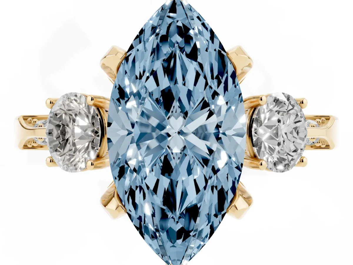 Fancy Blue Marquise Cut Brilliant Three-Stone Diamond Ring with Pavé Band and Four-Prong Setting Yellow gold