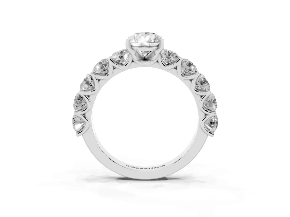 Pear Cut Diamond Prong Setting with Side Stones on a Pave Band Silver