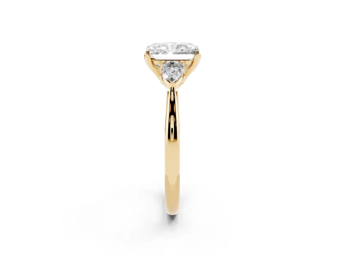 Three-Stone Radiant Cut Brilliant Diamond Solitaire Ring with Tapered Band and Four-Prong Setting Yellow gold