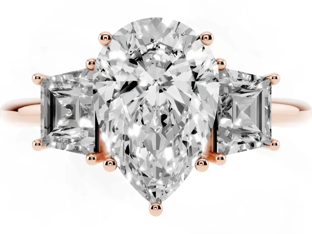 Pear Cut Diamond Three-Stone Ring with Trapezoid Side Stones and Prong Setting Rose gold