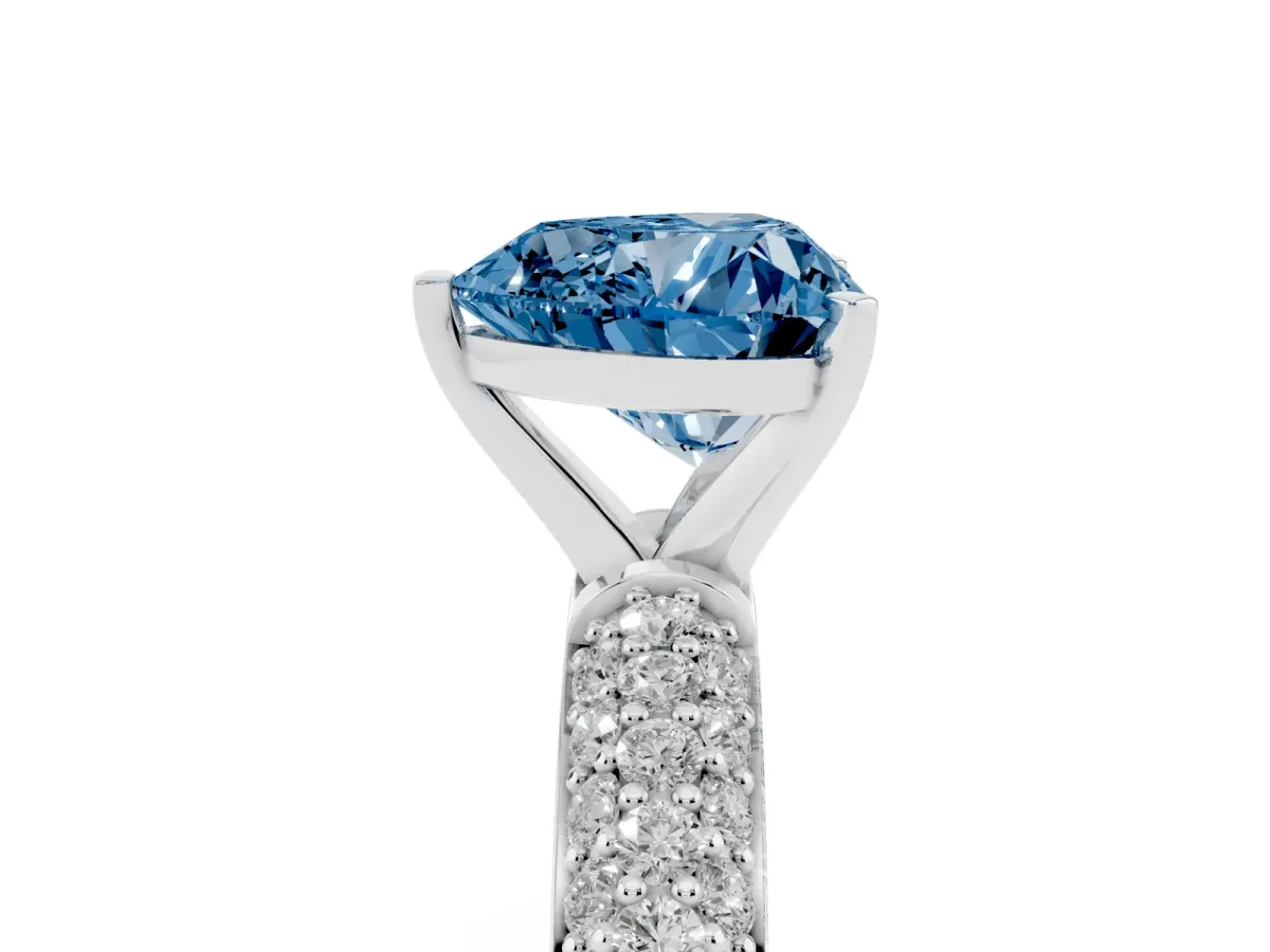 Fancy Blue Heart Cut Diamond Solitaire Ring with Prong Setting and Pavé Band Silver