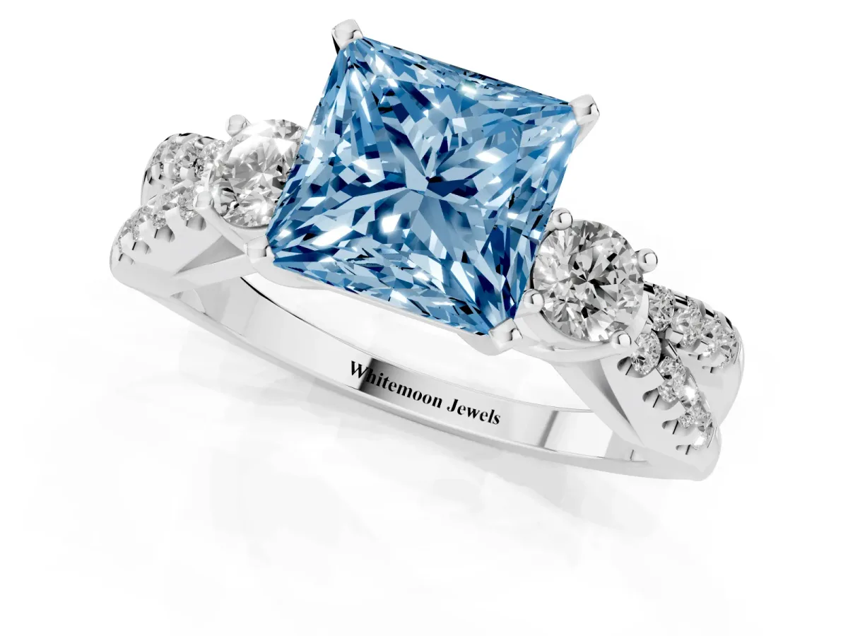 Fancy Blue Princess Cut Diamond Three-Stone Ring with Pavé Split Shank and Four-Prong Setting Silver