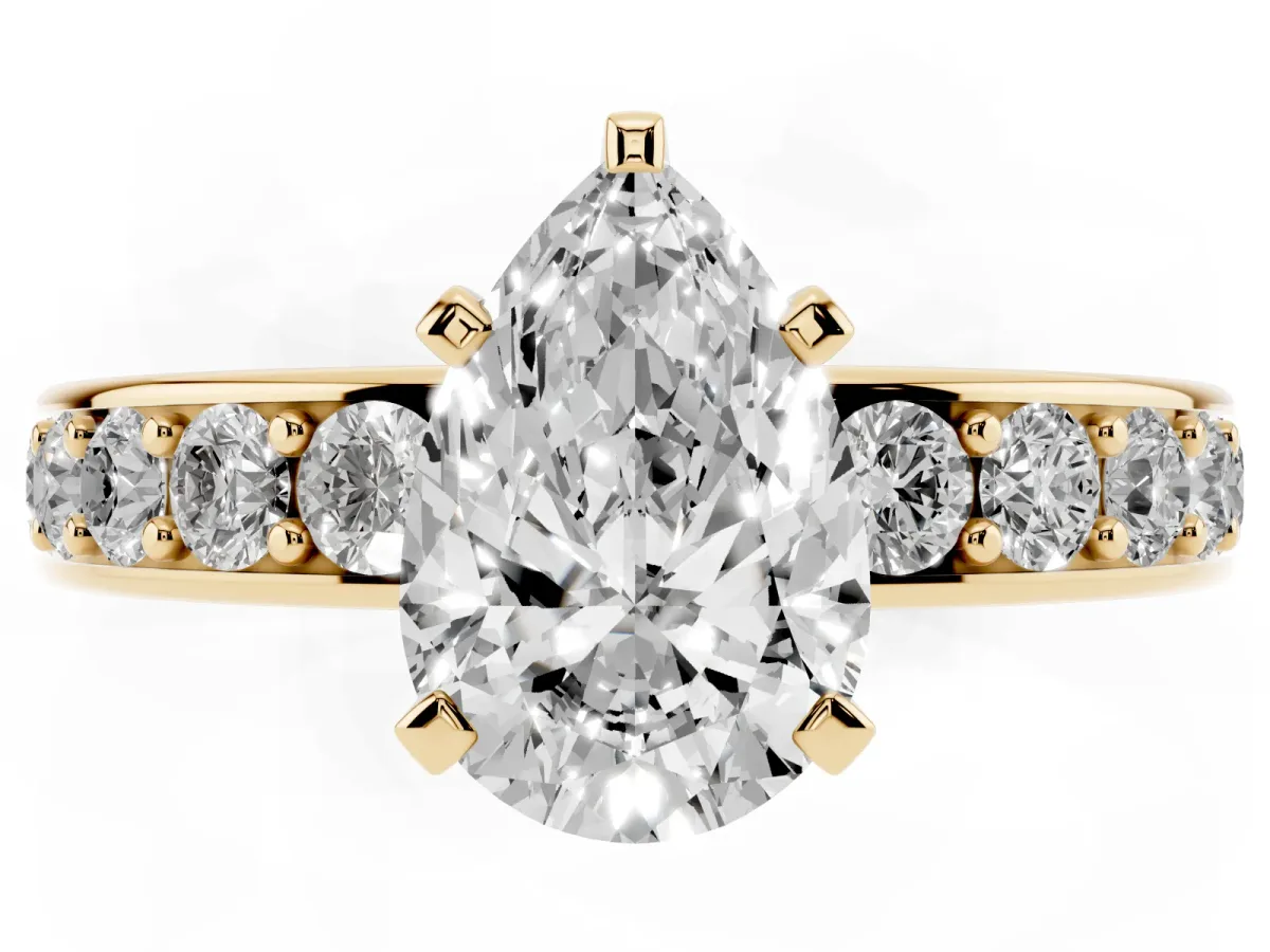 Pear Cut Diamond Engagement Ring with Channel Set Round Band and Prong Setting Yellow gold