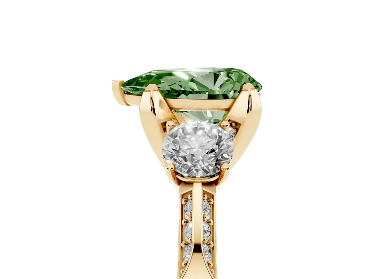Fancy Green Pear Cut Brilliant Three-Stone Diamond Ring with Pavé Band and Four-Prong Setting Yellow gold