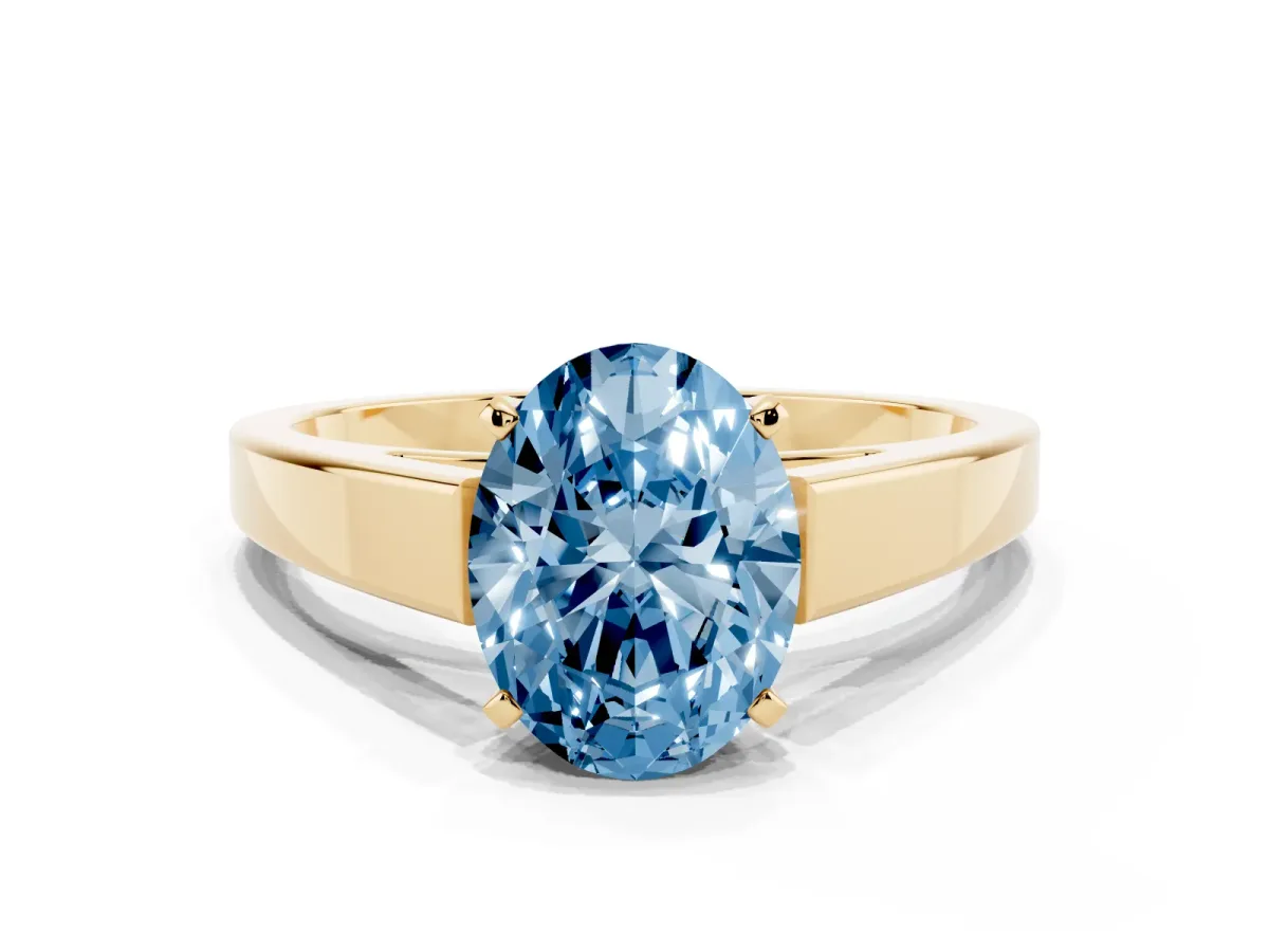 Fancy Blue Oval Cut Solitaire Engagement Ring with Four-Prong Setting and Tapered Band Yellow gold