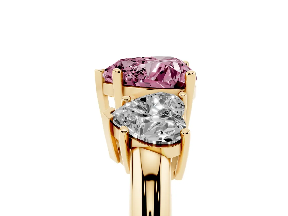 Fancy Pink Three-Stone Heart Cut Cut Diamond Engagement Ring with Prong Setting on a White Gold Band Yellow gold