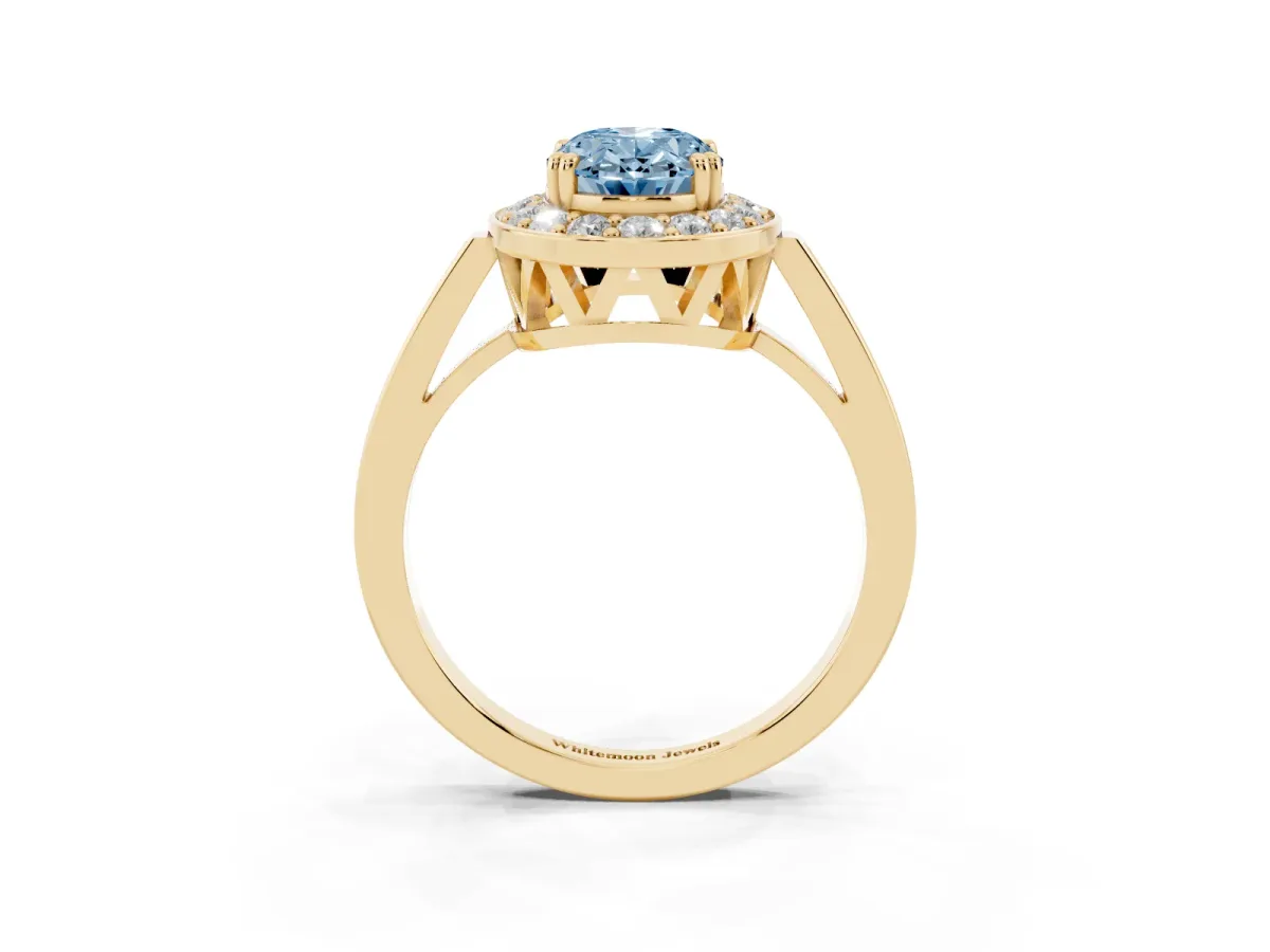 Fancy Blue Oval Cut Diamond Halo Ring with Split Shank and Four-Prong Setting Yellow gold