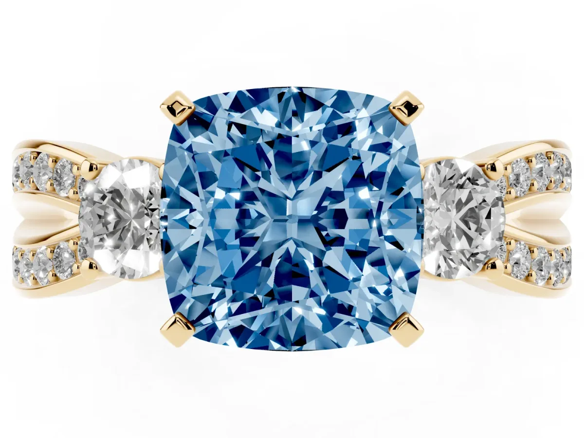 Fancy Blue Three-Stone Cushion Cut Cut Diamond Twist Band with Prong Setting Yellow gold
