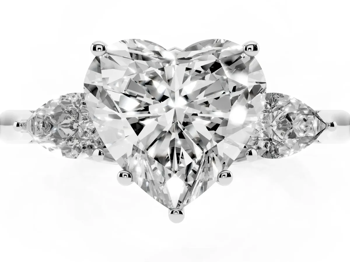 Heart Cut Diamond Three-Stone Ring with Pear Side Stones and Prong Setting Platinum