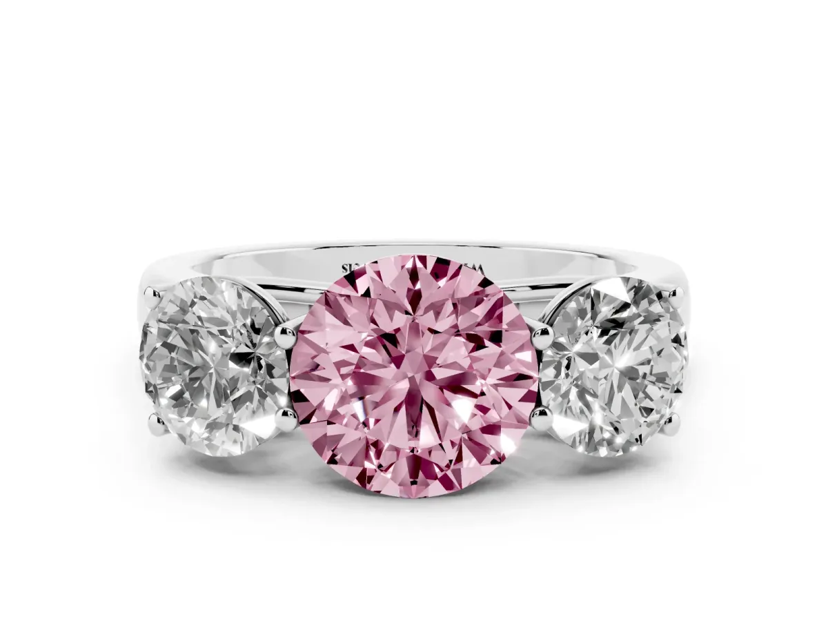 Fancy Pink Round Cut Three-Stone Diamond Ring with Prong Setting on a Classic Band Platinum