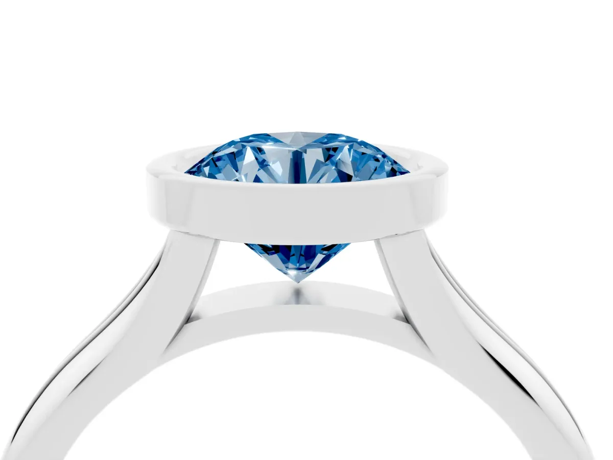 Fancy Blue Bezel Set Round Cut Solitaire Diamond Ring with Smooth Band Silver