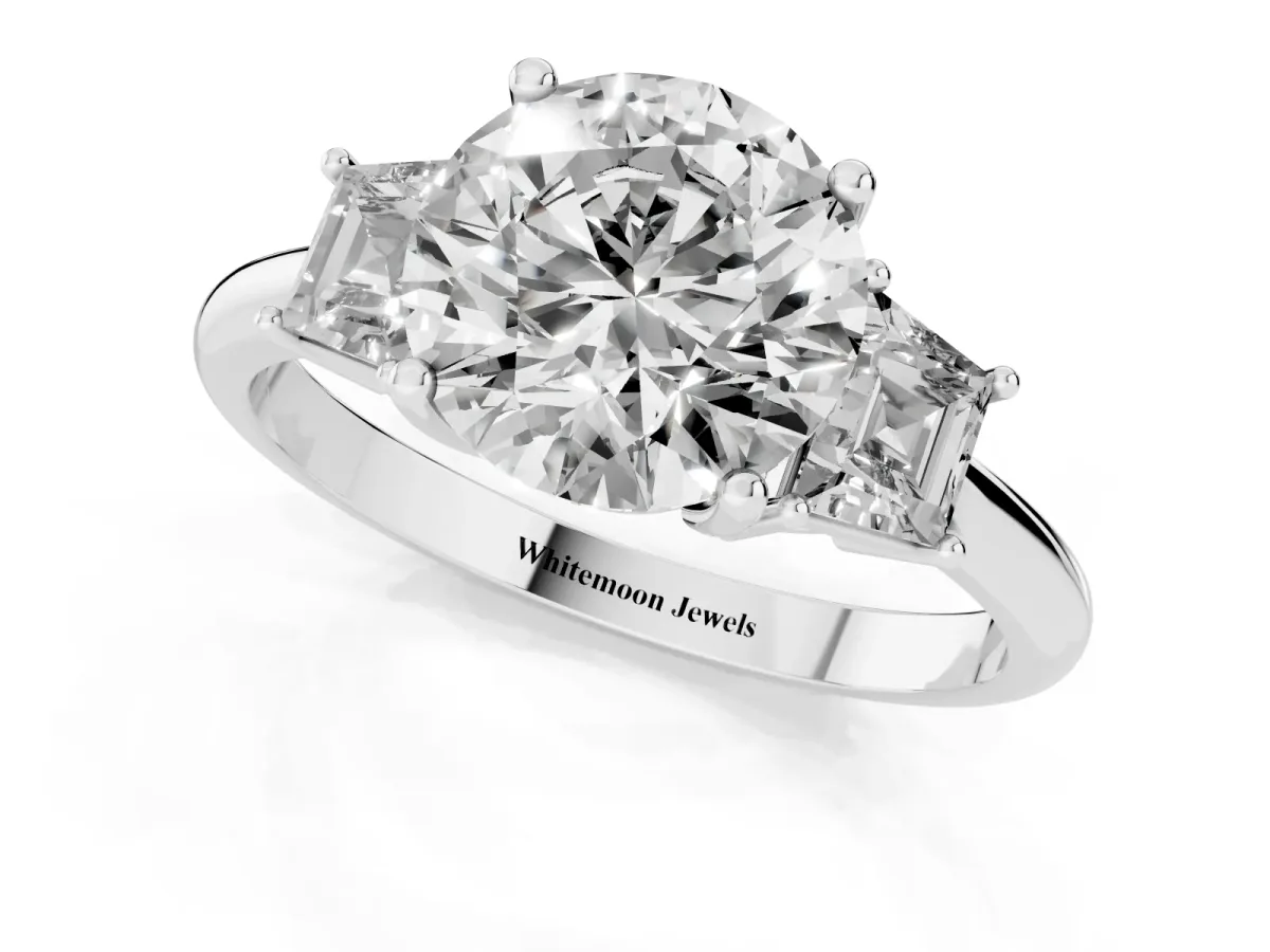 Round Cut Diamond Three-Stone Ring with Trapezoid Side Stones and Prong Setting Platinum