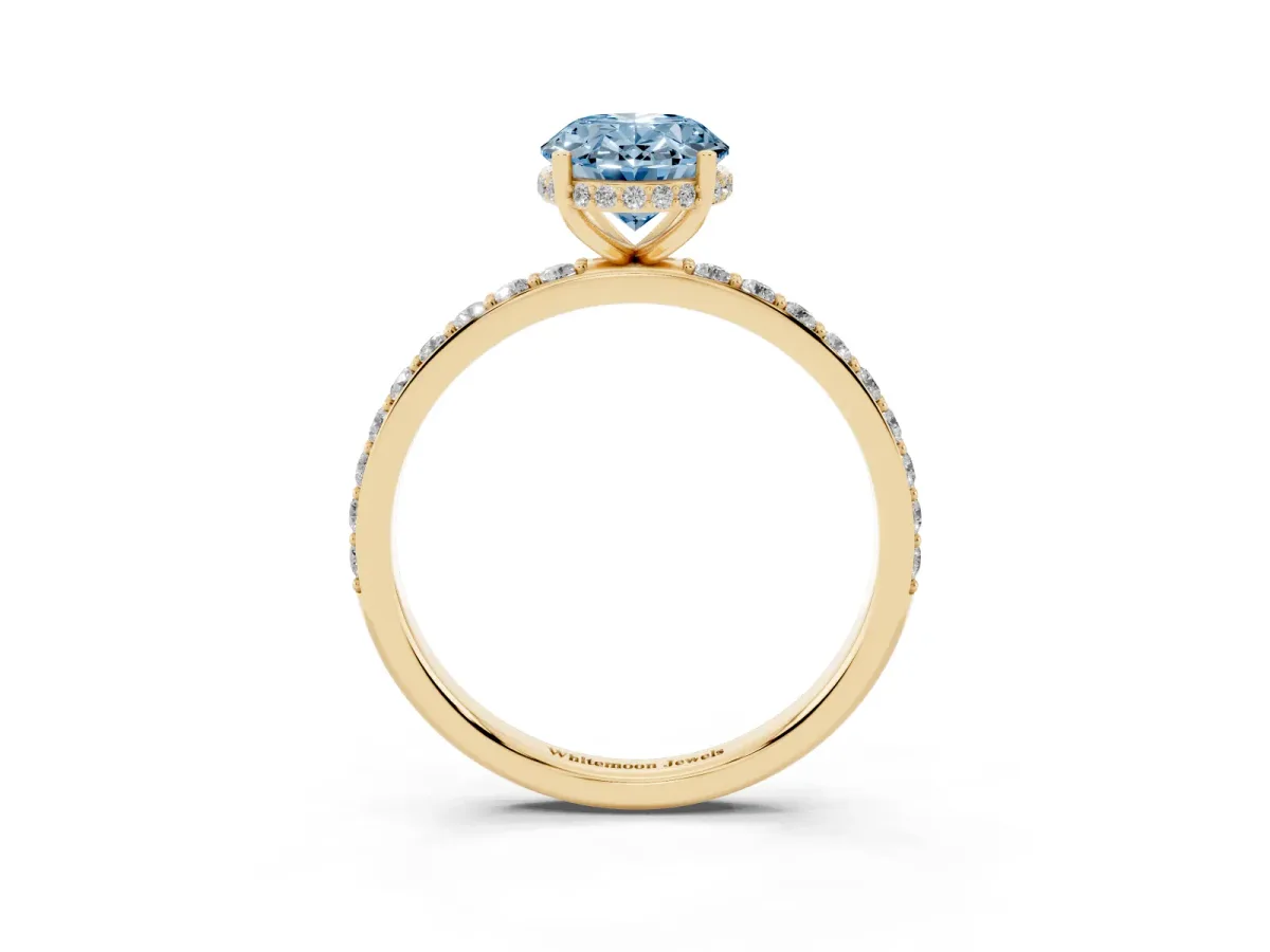 Fancy Blue Oval Cut Diamond Solitaire Ring with Pavé Band and Hidden Halo Yellow gold