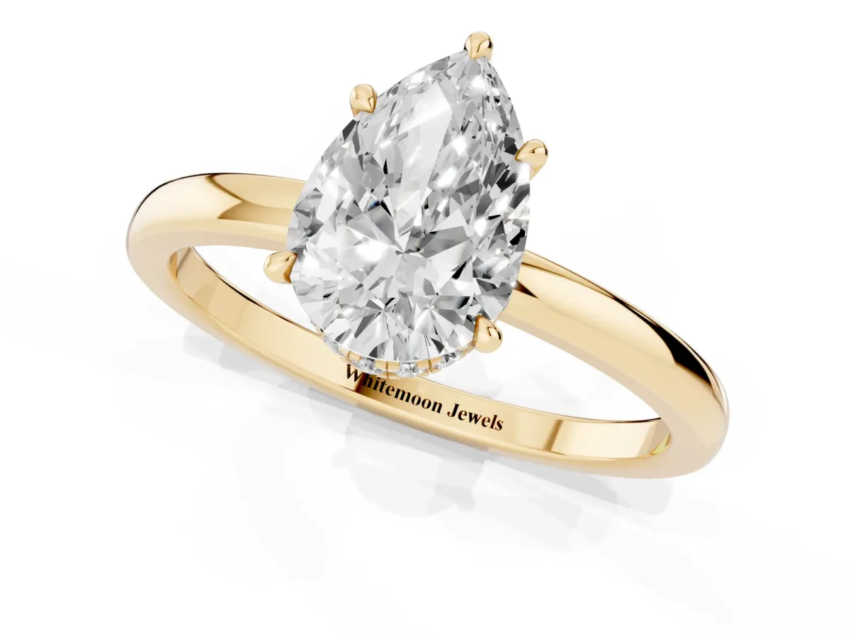 Pear Cut Solitaire Engagement Ring with Cathedral Band and Four-Prong Setting Yellow gold