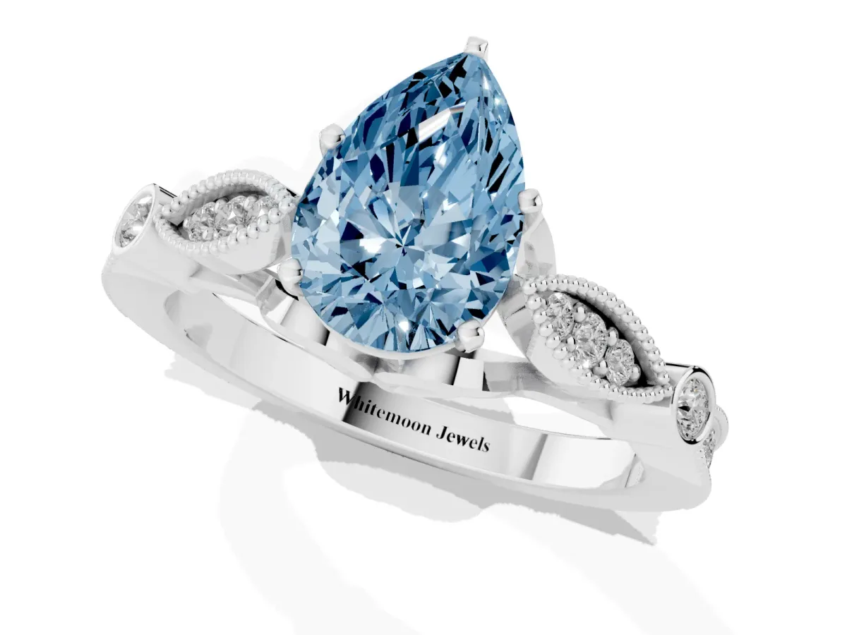 Fancy Blue Pear Cut Cut Diamond with Milgrain Marquise and Bezel Accents on a Solitaire Band with Prong Setting Platinum
