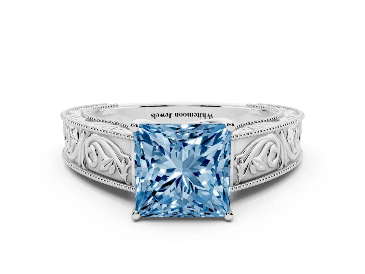 Fancy Blue Princess Cut Diamond Solitaire Ring with Engraved Band and Four-Prong Setting White gold