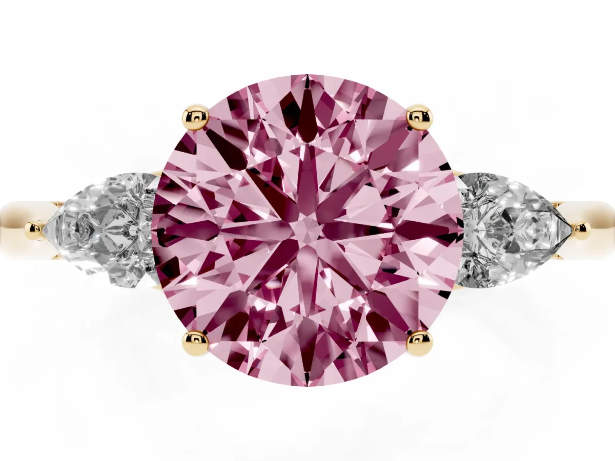 Fancy Pink Round Cut Diamond Three-Stone Ring with Pear Side Stones and Prong Setting Yellow gold