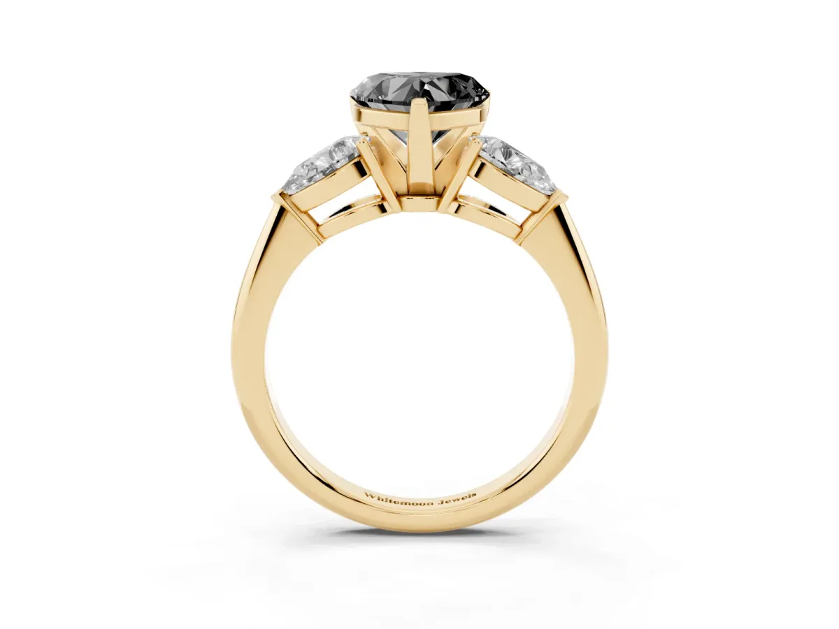 Fancy Black Three-Stone Heart Cut Diamond Ring with Pear Side Stones and Four-Prong Setting Yellow gold