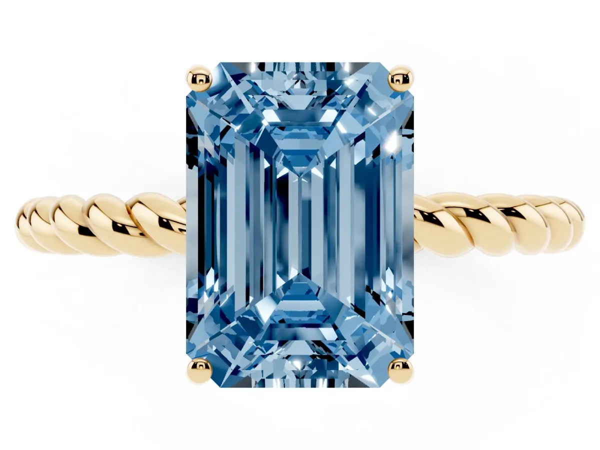 Fancy Blue Emerald Cut Solitaire Twist Band Ring with Four-Prong Setting Yellow gold