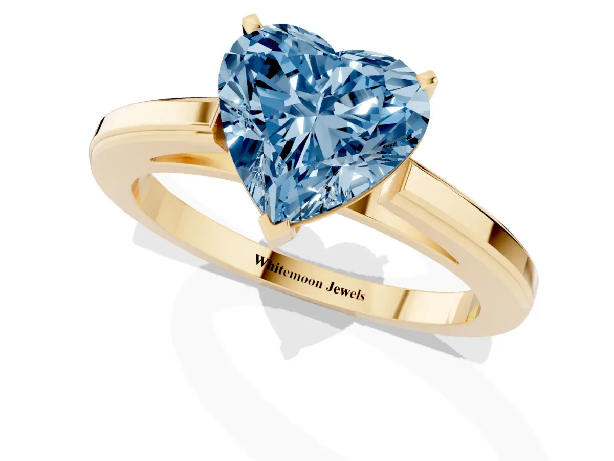 Fancy Blue Heart Cut Solitaire Diamond Ring with Four-Prong Setting and Classic Band Yellow gold