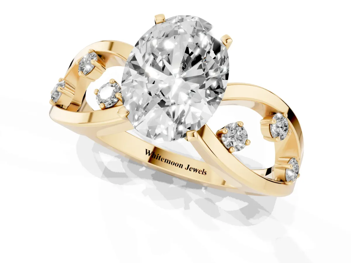 Oval Cut Cut Solitaire Diamond with Side Stones on Criss-Cross Band and Four-Prong Setting Yellow gold