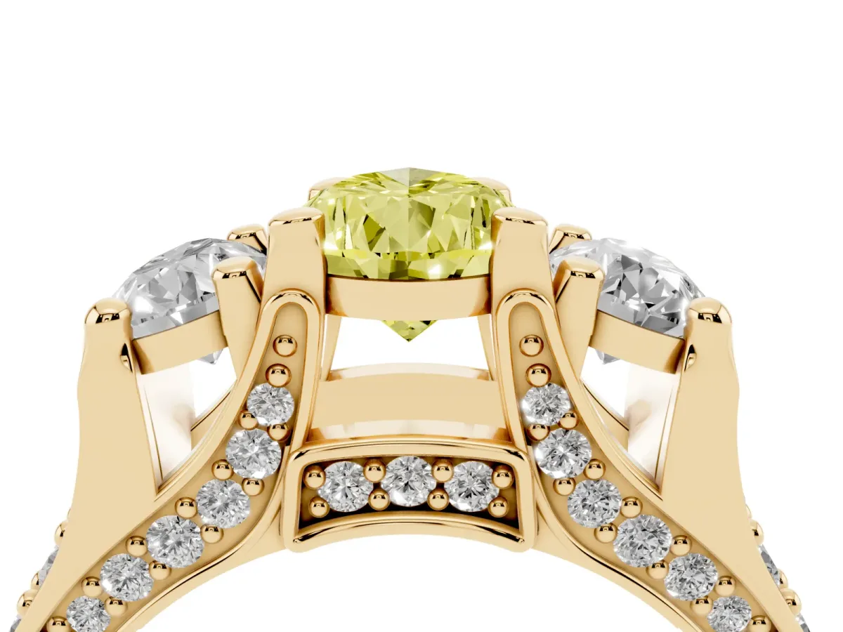 Fancy Yellow Pear Cut Diamond Three-Stone Ring with Channel Set Band and Four-Prong Setting Yellow gold