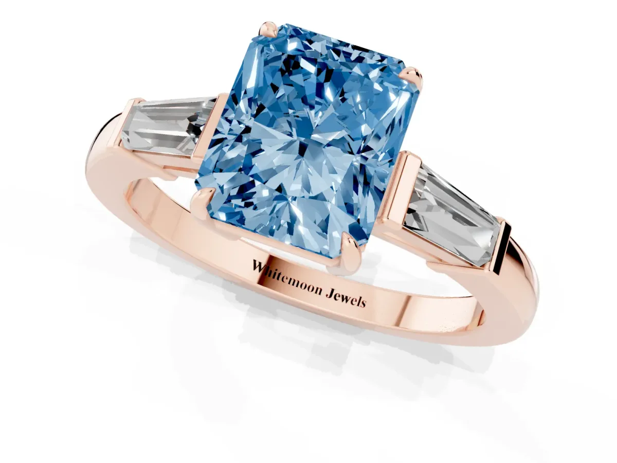 Fancy Blue Radiant Cut Diamond Three-Stone Ring with Tapered Baguette Side Stones and Prong Setting Rose gold