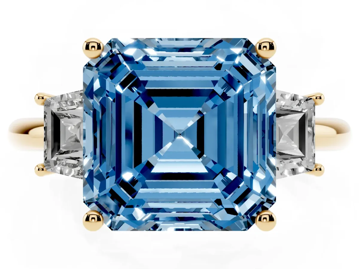 Fancy Blue Asscher Cut Diamond Three-Stone Ring with Trapezoid Side Stones and Prong Setting Yellow gold