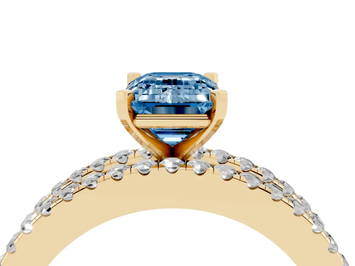 Fancy Blue Emerald Cut Diamond Solitaire Ring with Pavé and Channel Set Band Yellow gold
