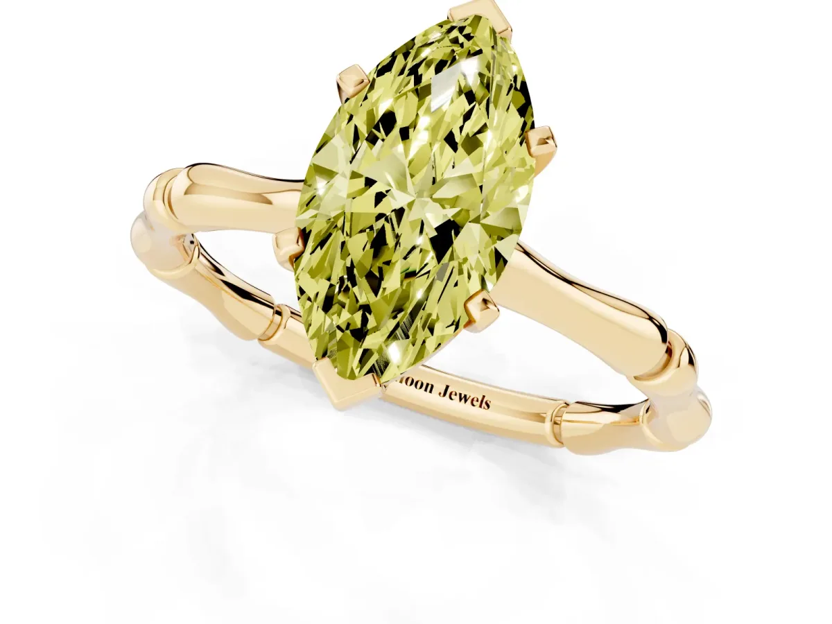 Fancy Yellow Marquise Cut Solitaire Diamond Ring with Bamboo Band and Four-Prong Setting Yellow gold