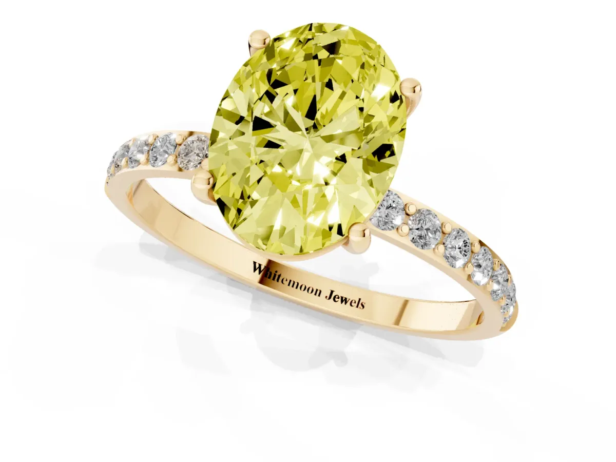 Fancy Yellow Oval Cut Diamond Solitaire Ring with Round Pavé Shoulders and Prong Setting Yellow gold