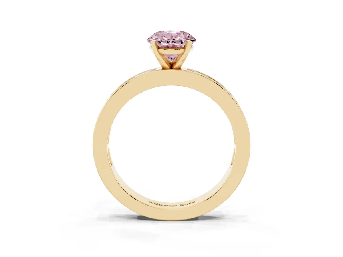 Fancy Pink Oval Cut Solitaire Diamond Ring with Channel-Set Baguette Band and Four-Prong Setting Yellow gold