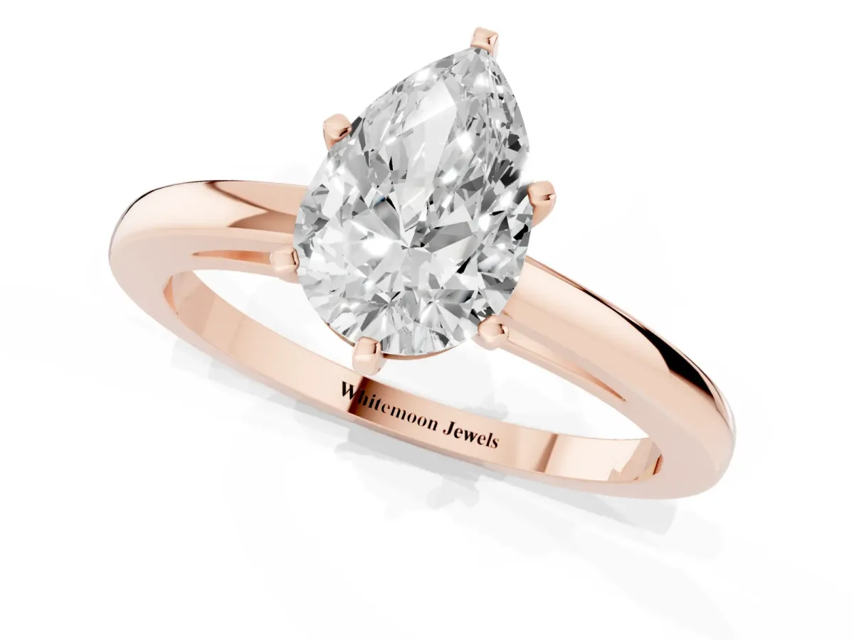 Pear Cut Solitaire Diamond Engagement Ring with Four-Prong Setting on a Classic Band Rose gold
