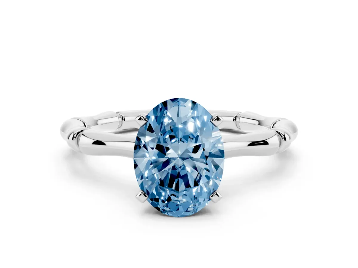 Fancy Blue Oval Cut Solitaire Diamond Ring with Bamboo Band and Four-Prong Setting Silver