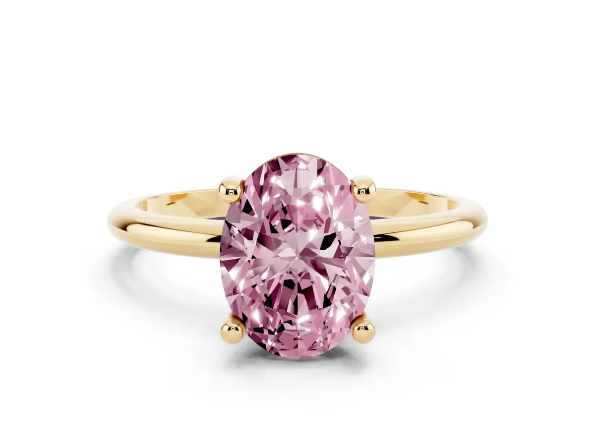 Fancy Pink Oval Cut Solitaire Diamond Ring with 4-Prong Setting on a Classic Band Yellow gold
