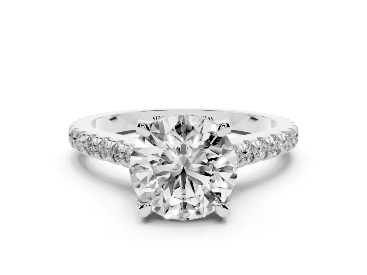 Round Cut Brilliant Diamond Solitaire with Pavé Band and Four-Prong Setting Silver