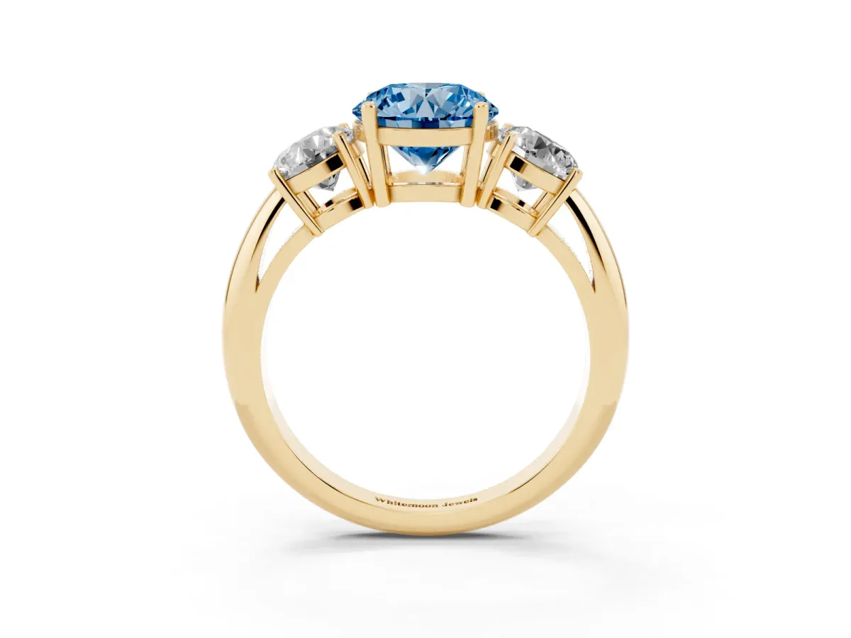 Fancy Blue Three-Stone Round Cut Cut Diamond Engagement Ring with Prong Setting on a White Gold Band Yellow gold