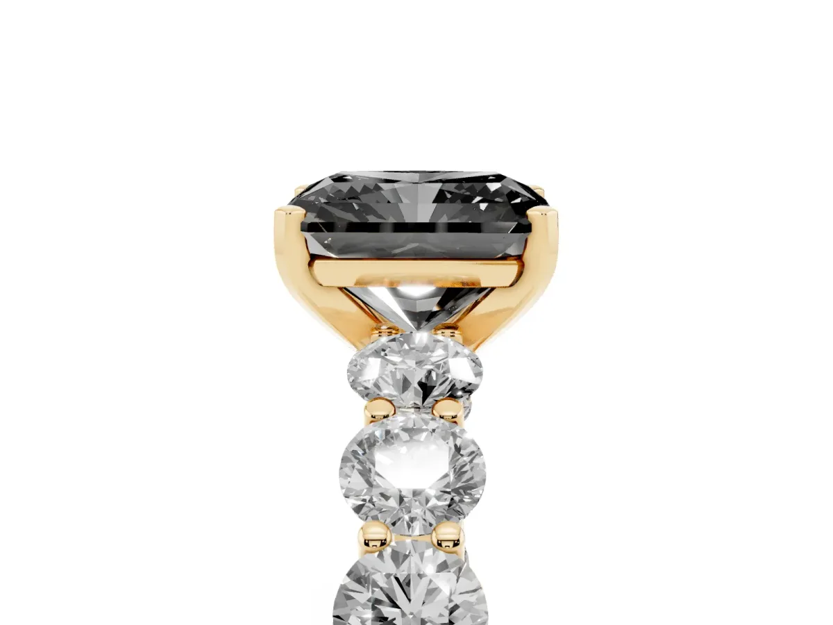 Fancy Black Radiant Cut Diamond Prong Setting with Side Stones on a Pave Band Yellow gold