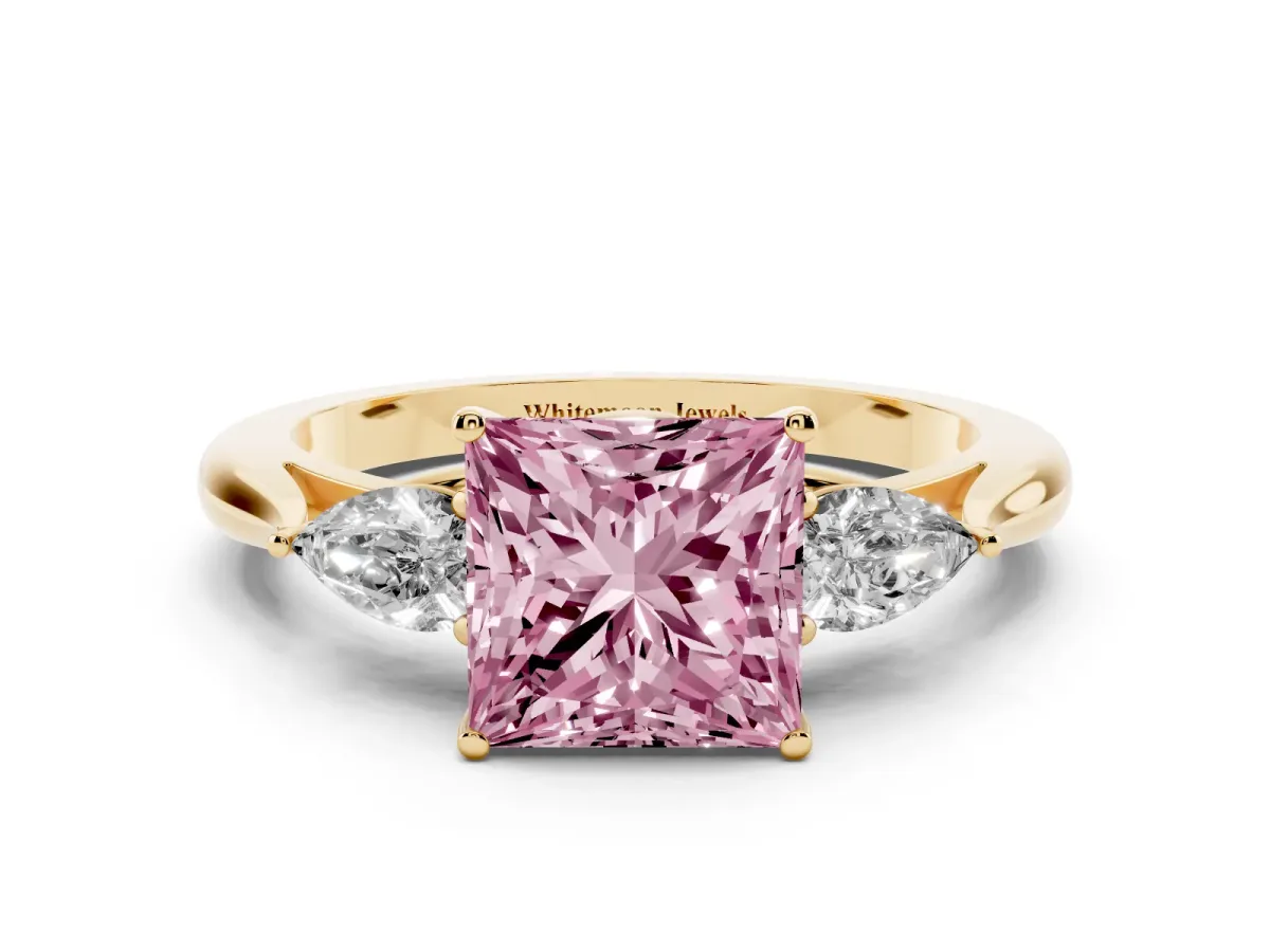 Fancy Pink Princess Cut Diamond Three-Stone Ring with Pear Side Stones and Prong Setting Yellow gold