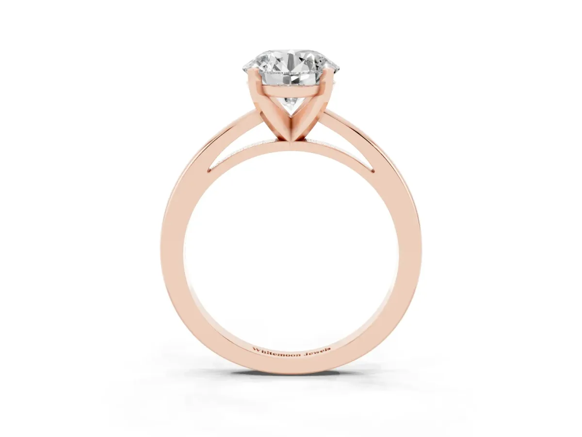 Round Cut Solitaire Diamond Engagement Ring with Four-Prong Setting on a Classic Band Rose gold