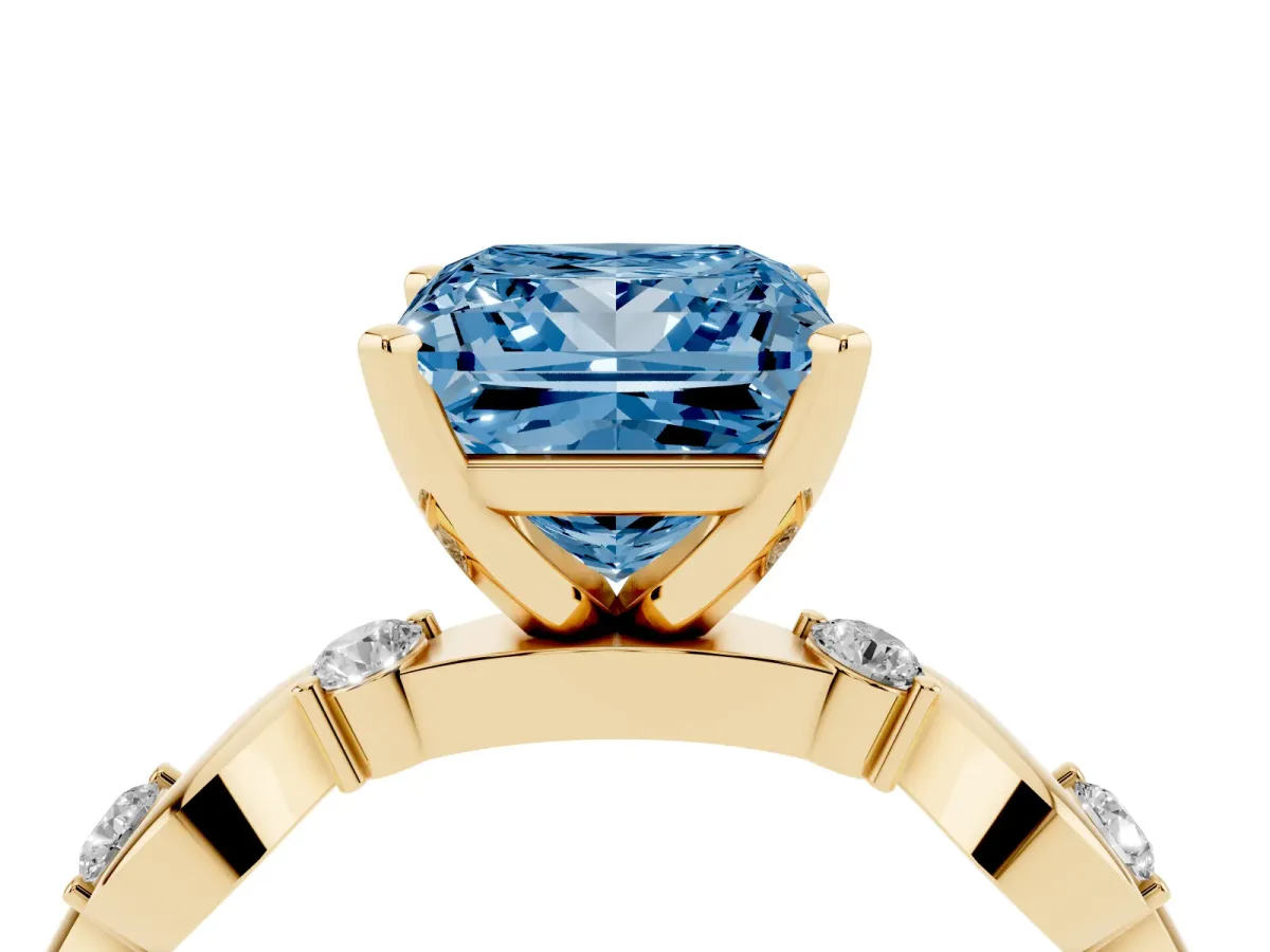 Fancy Blue Princess Cut Diamond Solitaire Twisted Band with Round Accents and Prong Setting Yellow gold