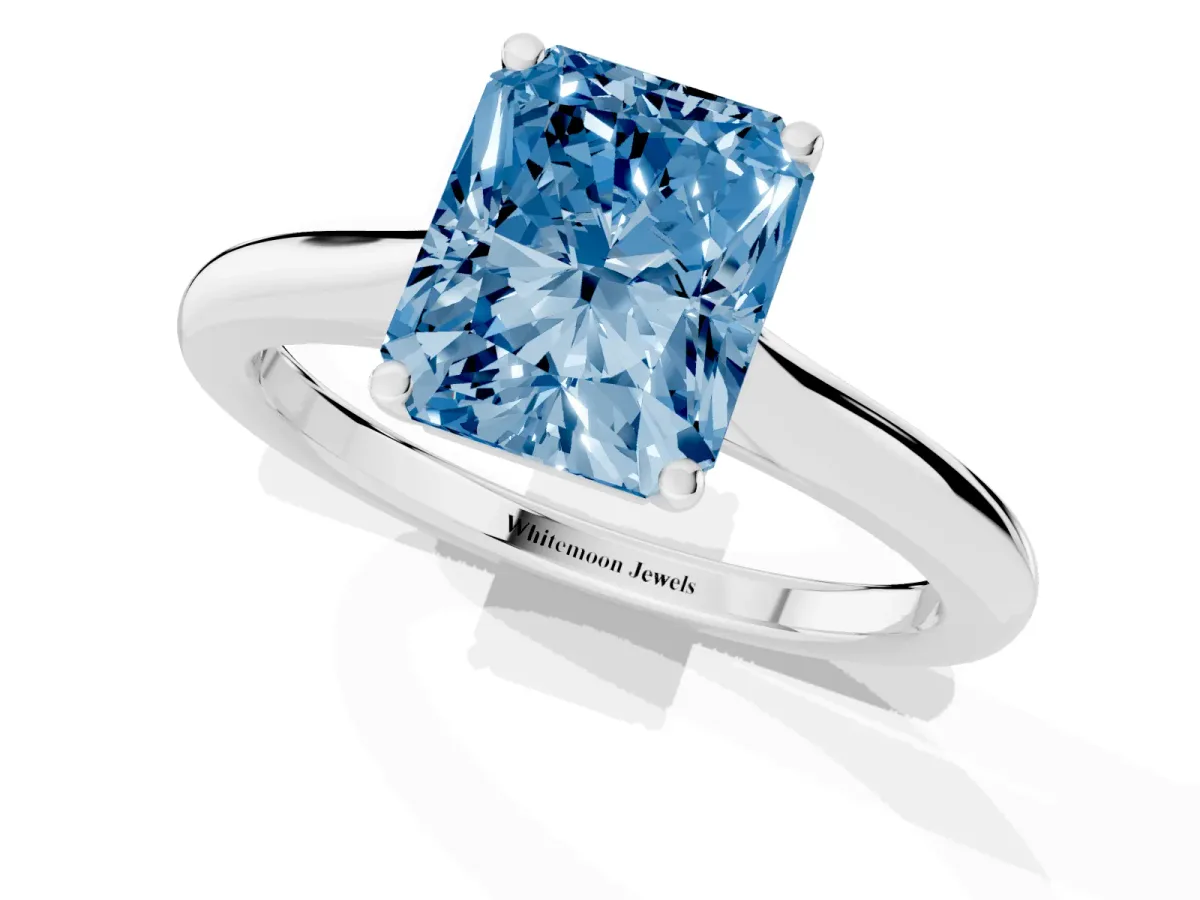 Fancy Blue Radiant Cut Cut Solitaire Ring with Cathedral Band and Four-Prong Setting Platinum