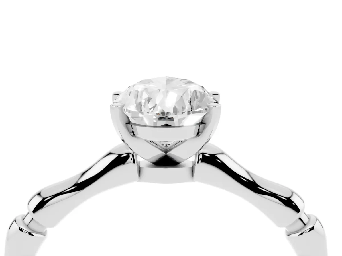 Pear Cut Solitaire Diamond Ring with Bamboo Band and Four-Prong Setting Platinum