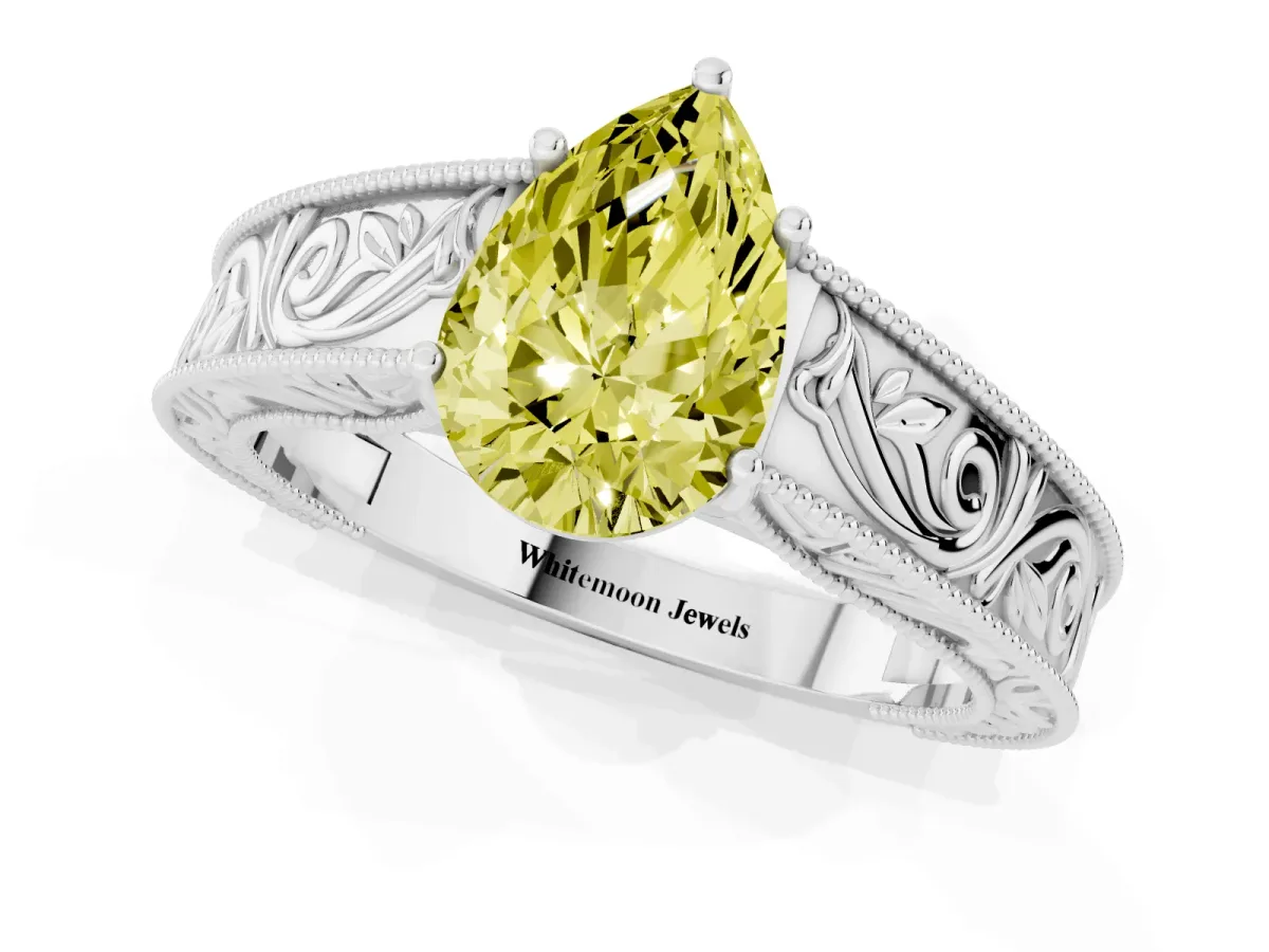 Fancy Yellow Pear Cut Diamond Solitaire Ring with Engraved Band and Four-Prong Setting Silver