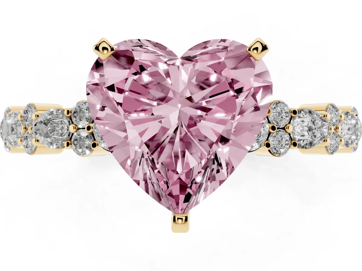 Fancy Pink Heart Cut Diamond Side Stone Solitaire Ring with Round and Four-Prong Setting Yellow gold