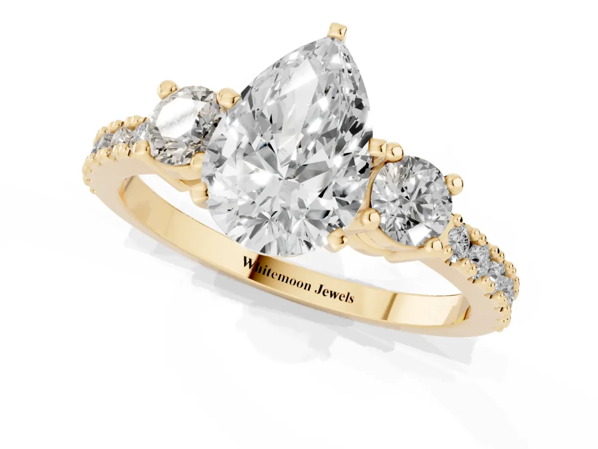 Pear Cut Three-Stone Diamond Pavé Band with Prong Setting Yellow gold